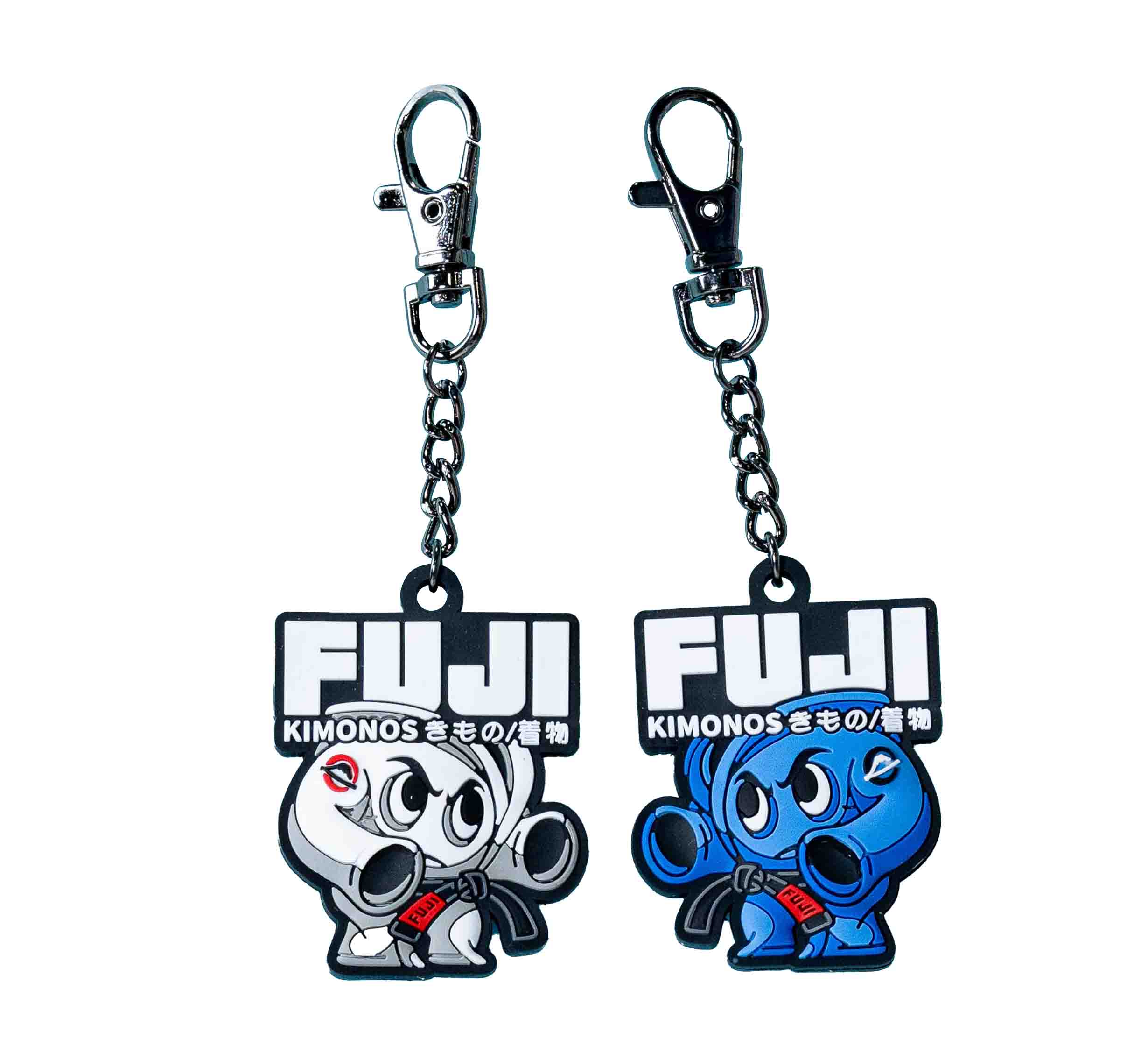 The FUJI Kimono Keychain White features a cartoon character in a white kimono holding a black belt, with “FUJI KIMONOS” in bold white letters above and Japanese characters below.