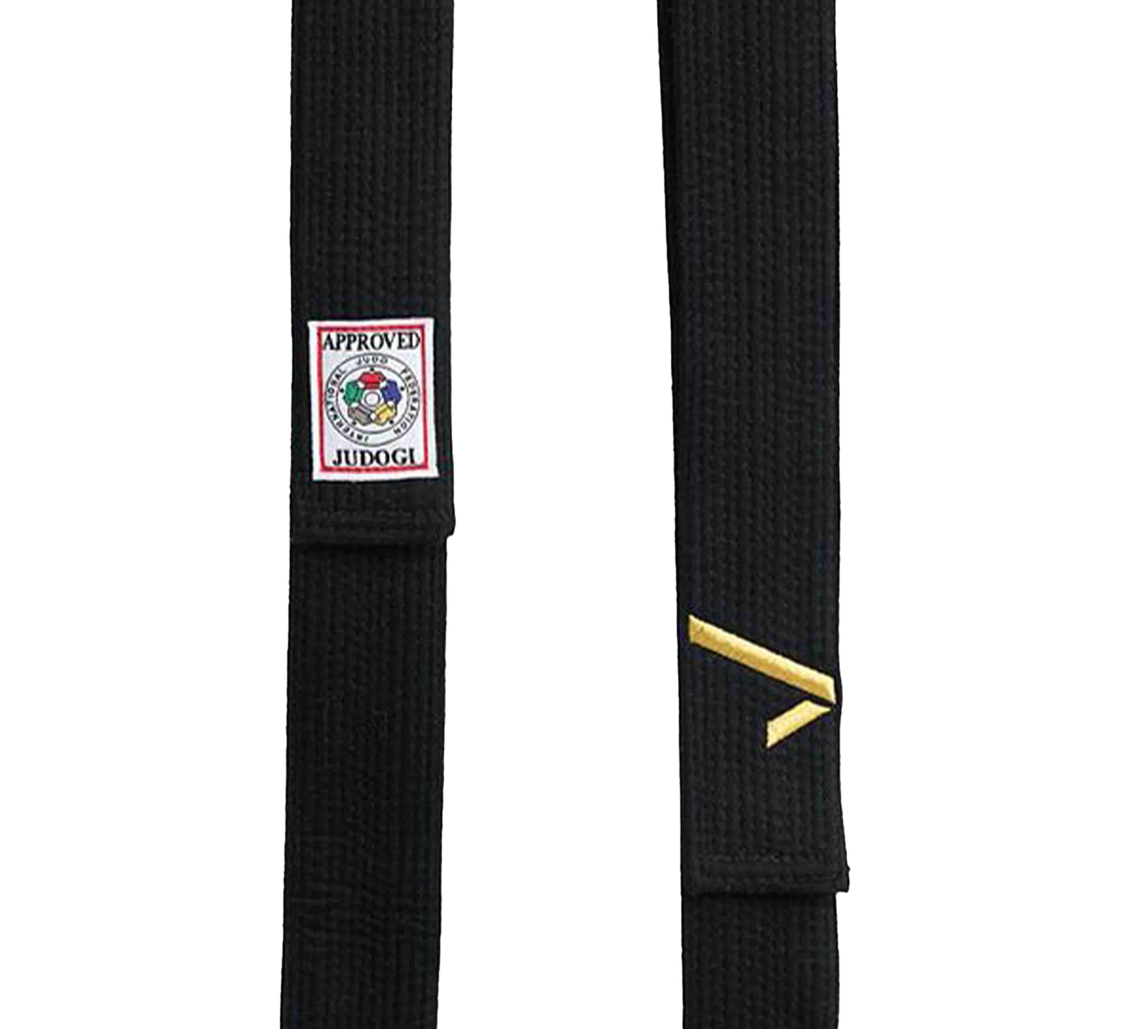 A close-up of the Ippon Gear Legend IJF Black Belt features a certification patch reading APPROVED JUDOGI and a small gold geometric symbol on the black fabric, set against a white background.