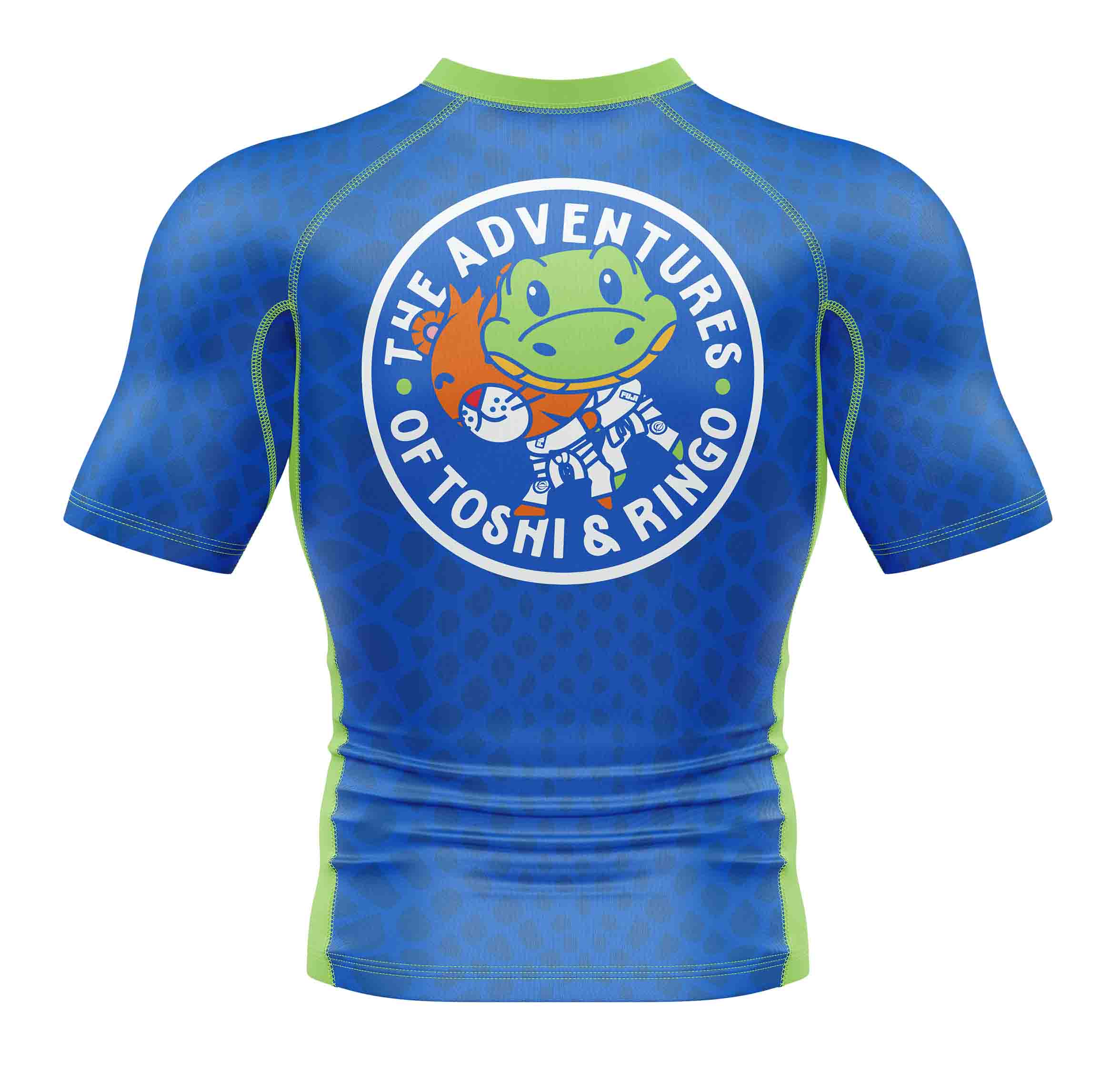 The Kids Ringo Rashguard Blue/Green is a short-sleeve athletic shirt with a circular back logo showing a cartoon frog in an astronaut suit and a small orange fox, plus text: The Adventures of Toshi & Ringo.