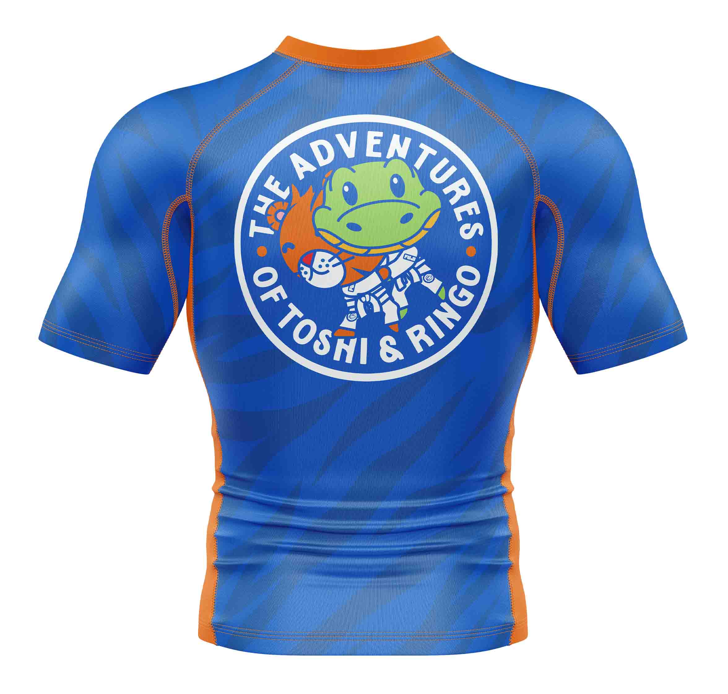 The Kids Toshi Rashguard Blue/Orange is a short-sleeve athletic shirt with a circular back logo showing a green cartoon frog in a spacesuit holding an orange creature, with "The Adventures of Toshi & Ringo" written around it.