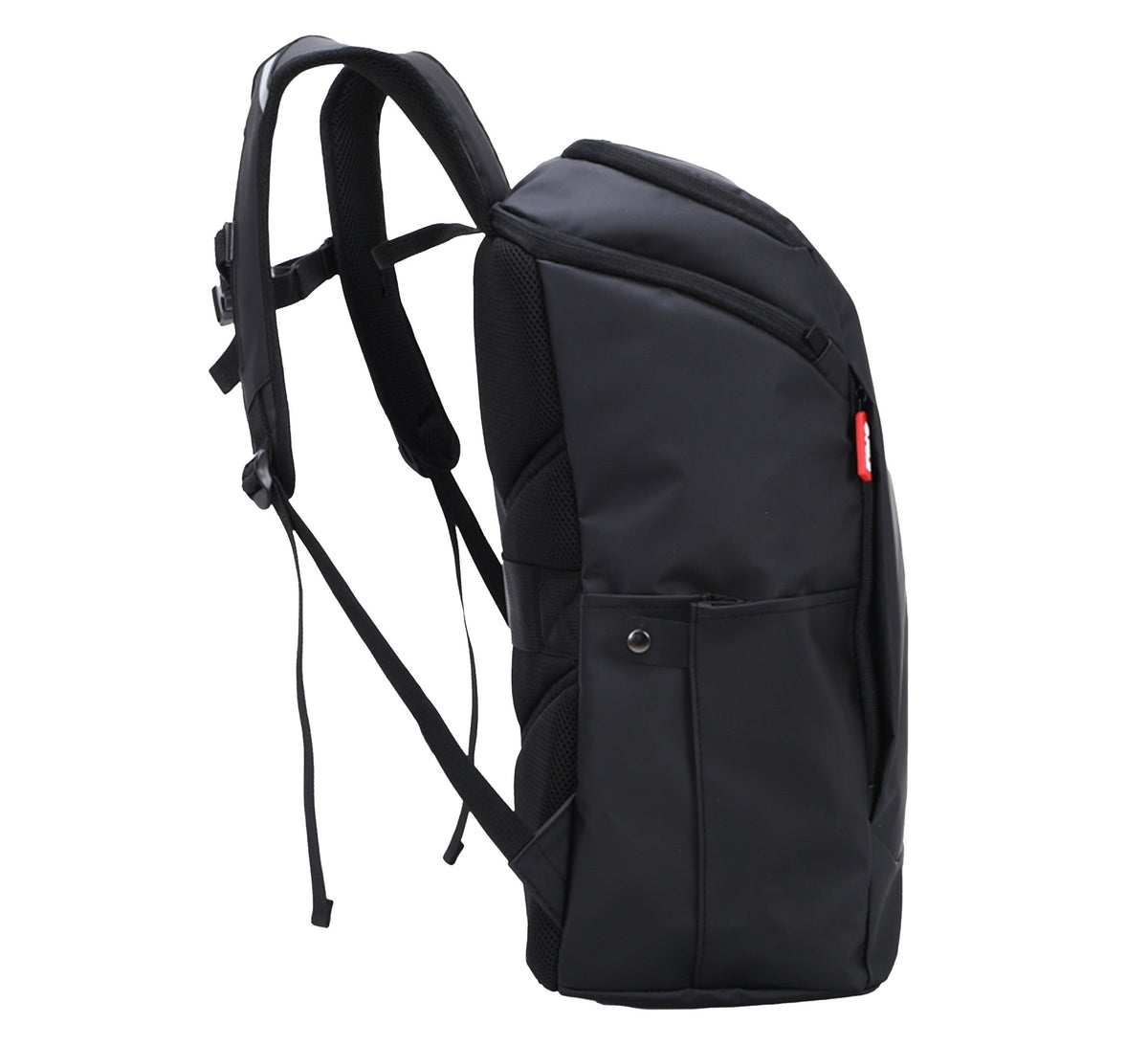 The Urban Day Backpack Black features padded shoulder straps, a side pocket, and a red logo tag. It is shown upright from the side against a white background.