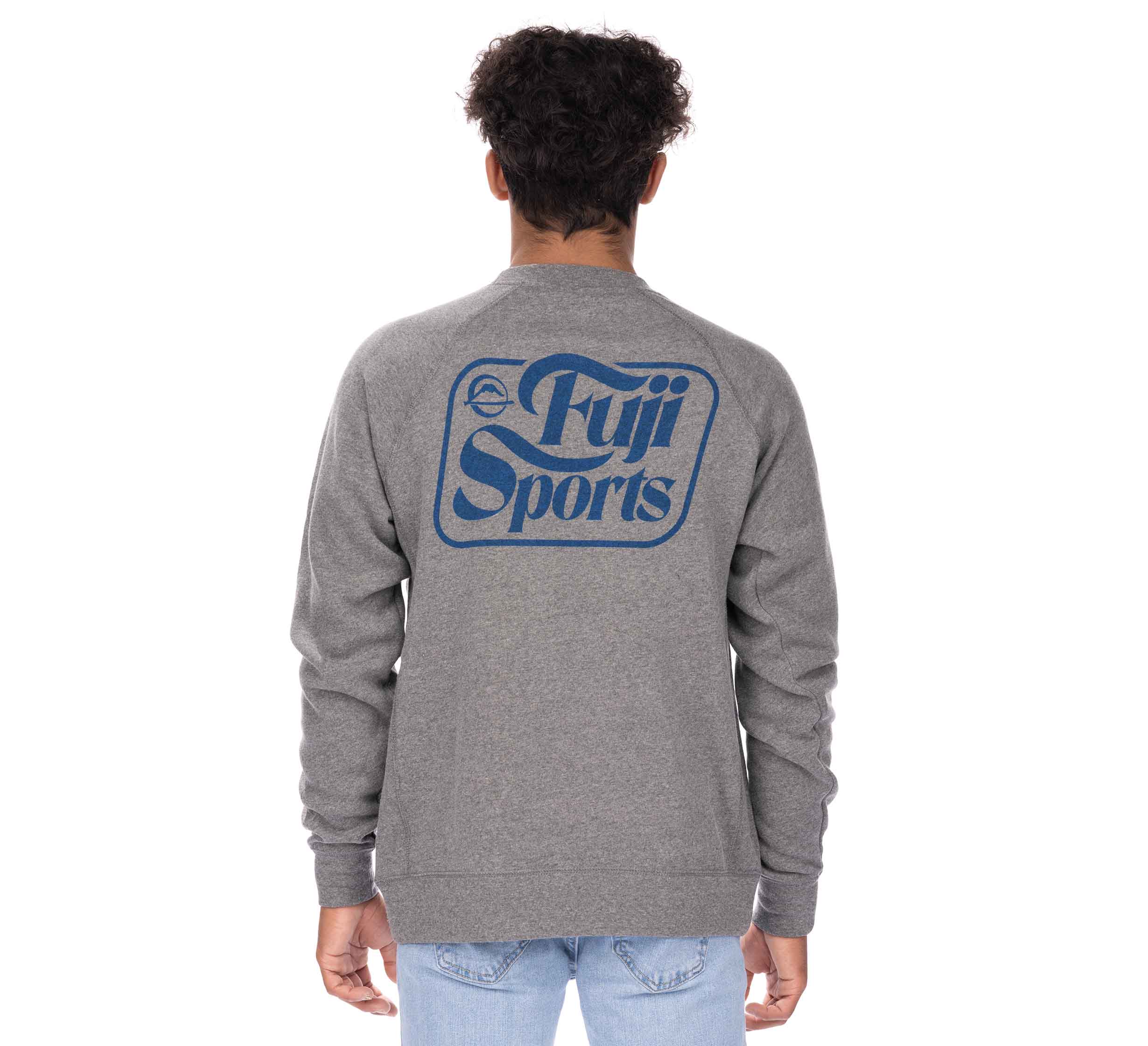 A person with short curly hair is standing and facing away from the camera, wearing a grey Wave Crewneck Men's Sweatshirt with Fuji Sports written in blue on the back.