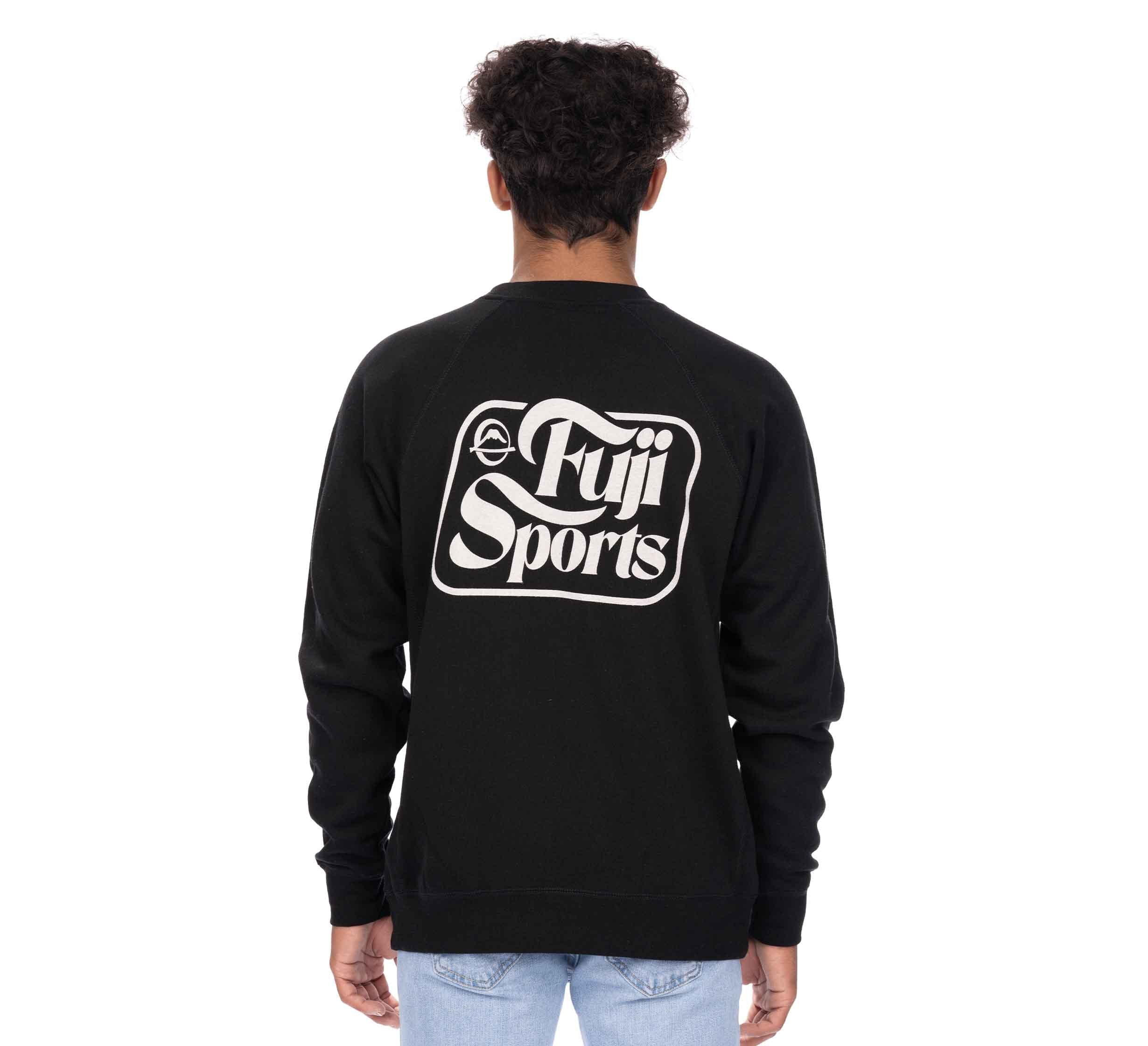 A person with short curly hair, seen from behind, wears a black Wave Crewneck Men's Sweatshirt and light blue jeans against a plain white background.