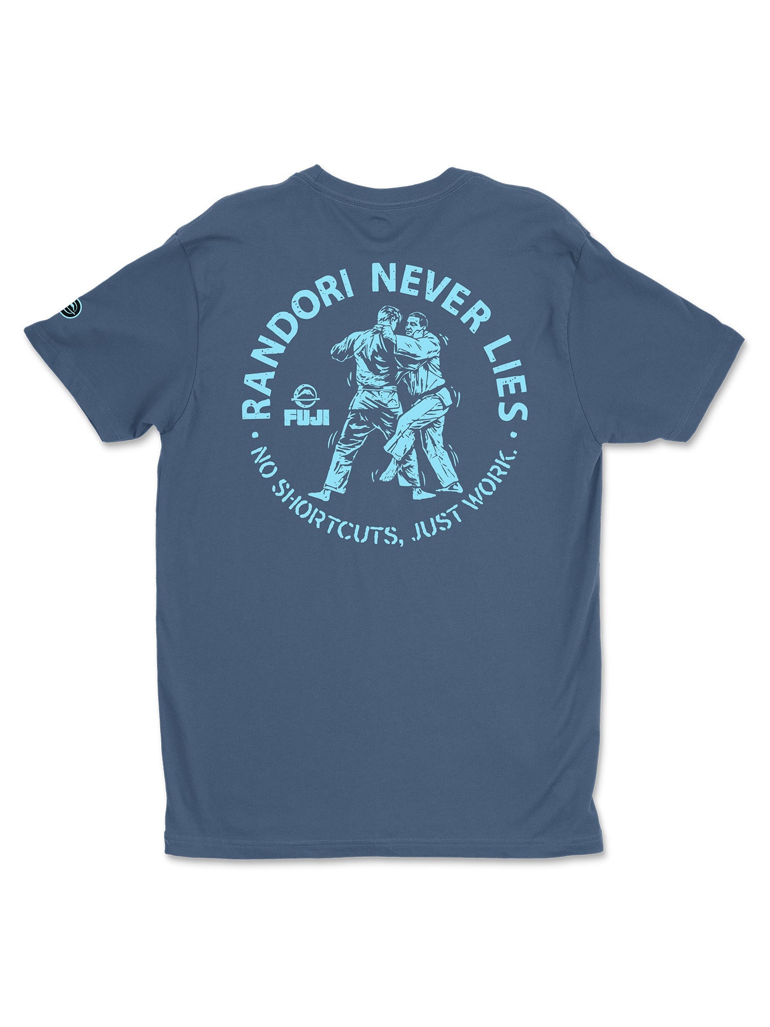 The Randori Never Lies Vintage Shirt Blue features an illustration of two people practicing judo. The text above reads “RANDORI NEVER LIES,” while below it says “NO SHORTCUTS, JUST WORK!” with the Fuji logo on the left.